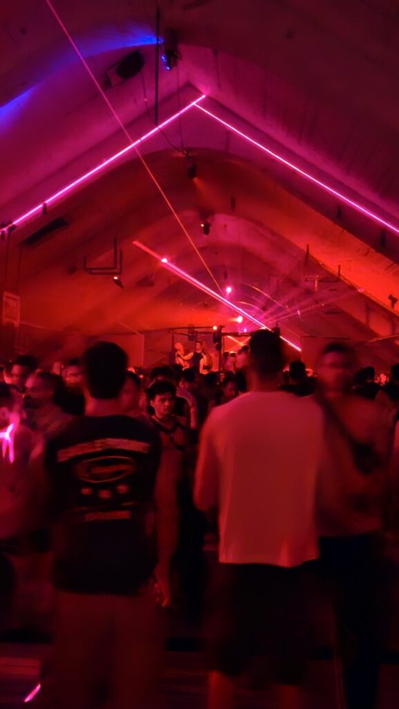 Crowd dancing at a party inside a underground club in Belgrade, Serbia.