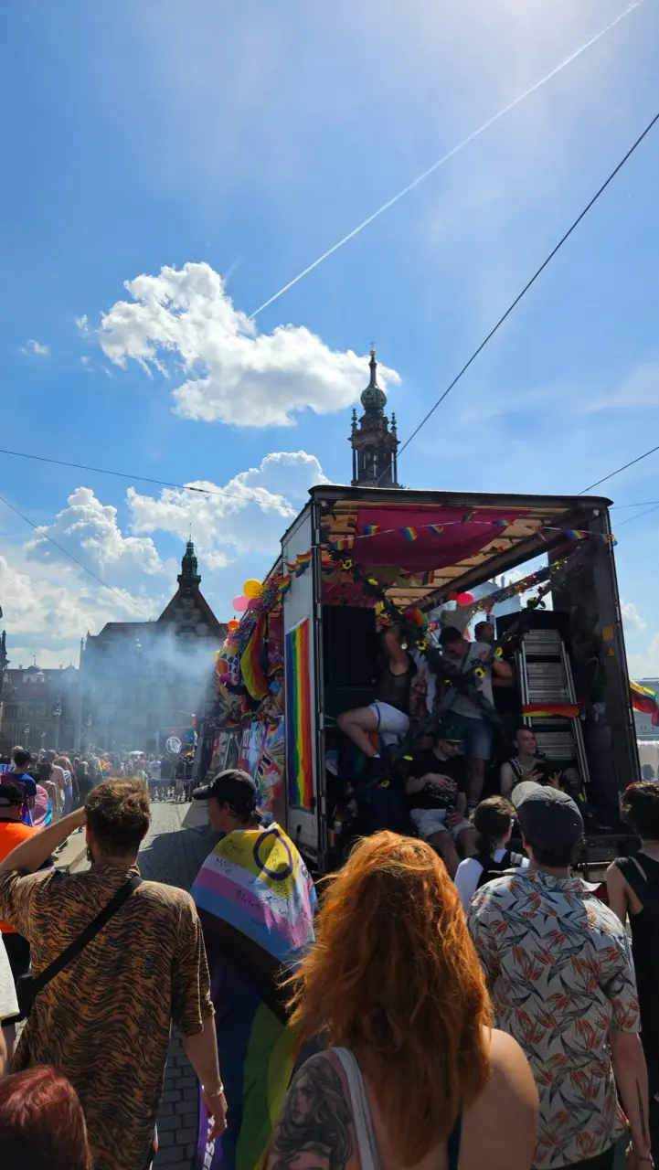Dresden Pride parade crossing the city centre with rainbow flags and LGBTQ+ supporters