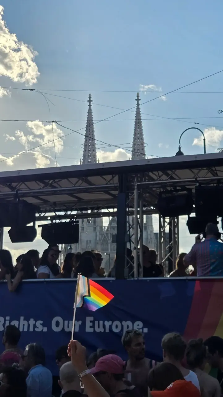 Thousands of participants carrying rainbow flags march along Vienna's Ringstrasse during Vienna Pride, celebrating LGBTQ+ equality in the Austrian capital.
