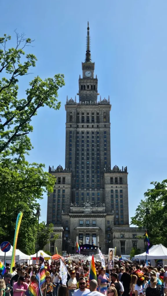 Warsaw Pride parade with rainbow flags and thousands of LGBTQ+ participants in the city centre