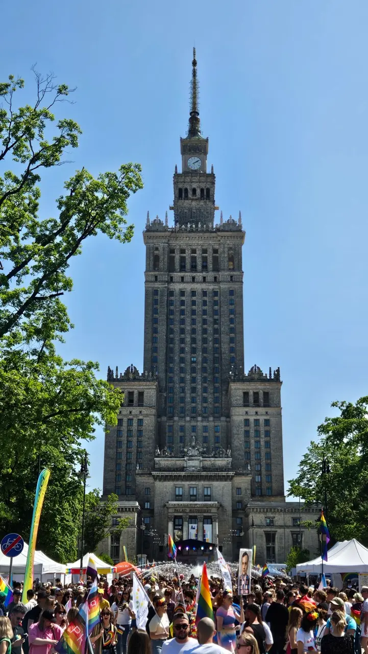Warsaw Pride parade with rainbow flags and thousands of LGBTQ+ participants in the city centre